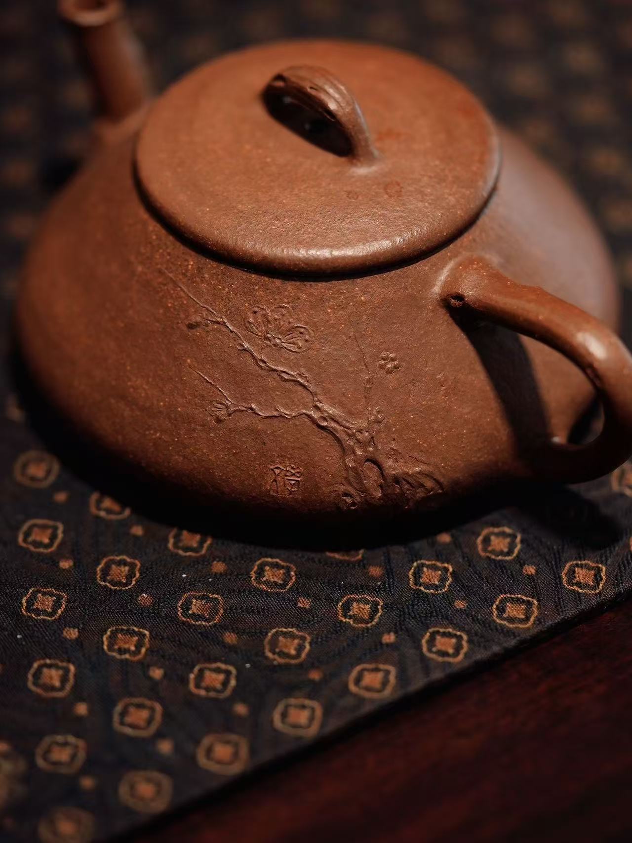 Wood-fired teapot with incised plum branch